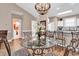 Open concept living space with dining table, kitchen and view to bathroom and bedroom at 4787 Wild Iris Dr. # 303, Myrtle Beach, SC 29577