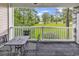 Covered patio with metal table and chairs offering beautiful golf course views at 4787 Wild Iris Dr. # 303, Myrtle Beach, SC 29577