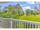 Covered porch shows green golf course views, and blue skies at 4787 Wild Iris Dr. # 303, Myrtle Beach, SC 29577