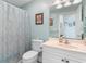 Bathroom featuring a white vanity, and blue patterned shower curtain at 4818 Harvest Dr., Myrtle Beach, SC 29579