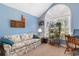 Inviting bedroom featuring a large window, comfortable couch, and charming decor, perfect for relaxing or working at 4818 Harvest Dr., Myrtle Beach, SC 29579