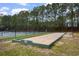 Community bocce ball court with mature trees surrounding at 4818 Harvest Dr., Myrtle Beach, SC 29579