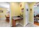 Convenient built-in desk area with granite countertop and storage, connecting kitchen and dining spaces at 4818 Harvest Dr., Myrtle Beach, SC 29579