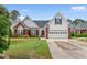 Charming single-Gathering home with a brick and vinyl exterior, complemented by a well-manicured lawn at 4818 Harvest Dr., Myrtle Beach, SC 29579