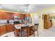 Well-lit kitchen with stainless steel appliances, a center island, and custom wood cabinets at 4818 Harvest Dr., Myrtle Beach, SC 29579