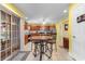 An open kitchen space, featuring an island with seating, seamlessly connected to the breakfast nook at 4818 Harvest Dr., Myrtle Beach, SC 29579