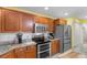 Modern kitchen with stainless steel appliances, granite countertops, and custom wood cabinets at 4818 Harvest Dr., Myrtle Beach, SC 29579