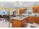 Open kitchen featuring stainless appliances, granite countertops, and an island with breakfast bar seating at 4818 Harvest Dr., Myrtle Beach, SC 29579