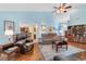 Inviting living room with a vaulted ceiling, multiple seating areas, and a view into the kitchen at 4818 Harvest Dr., Myrtle Beach, SC 29579