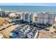 Aerial view of a beach community with ocean views, convenient parking, and nearby local attractions at 5806 N Ocean Blvd. # 203, North Myrtle Beach, SC 29582