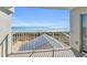 Balcony boasting a clear ocean view and a spot to relax in the sun at 5806 N Ocean Blvd. # 203, North Myrtle Beach, SC 29582