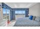 Cozy bedroom with ocean view, complemented by stylish coastal decor and plenty of natural light at 5806 N Ocean Blvd. # 203, North Myrtle Beach, SC 29582