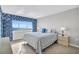 Comfortable bedroom with ocean view windows, soft natural light, and a relaxing coastal vibe at 5806 N Ocean Blvd. # 203, North Myrtle Beach, SC 29582