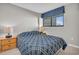 Bedroom featuring a bed, nightstands, and a window with blinds at 5806 N Ocean Blvd. # 203, North Myrtle Beach, SC 29582