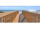 Inviting wooden boardwalk leading directly to the sandy beach and ocean at 5806 N Ocean Blvd. # 203, North Myrtle Beach, SC 29582