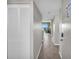 Hallway leading to a living area with ocean views through large windows and comfortable seating at 5806 N Ocean Blvd. # 203, North Myrtle Beach, SC 29582