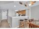 Kitchen with bar seating overlooking the kitchen and open access to a dining room at 5806 N Ocean Blvd. # 203, North Myrtle Beach, SC 29582