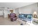 Living room with comfortable seating, tile floors, and open access to a kitchen and dining area at 5806 N Ocean Blvd. # 203, North Myrtle Beach, SC 29582