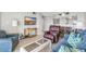 Open-concept living room with tile flooring, comfortable seating, and a view into the kitchen/dining area at 5806 N Ocean Blvd. # 203, North Myrtle Beach, SC 29582