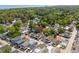 An aerial view showcases the home's location amongst beautiful mature trees and neighboring houses at 6001 - 1820A S Kings Hwy., Myrtle Beach, SC 29575