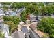 An aerial view showcases the home's location amongst beautiful mature trees and neighboring houses at 6001 - 1820A S Kings Hwy., Myrtle Beach, SC 29575