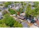 An aerial view showcases the home's location amongst beautiful mature trees and neighboring houses at 6001 - 1820A S Kings Hwy., Myrtle Beach, SC 29575