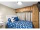 Comfortable bedroom featuring overhead storage and beach themed decor at 6001 - 1820A S Kings Hwy., Myrtle Beach, SC 29575