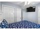 Comfortable bedroom featuring closet, TV, and light blue walls at 6001 - 1820A S Kings Hwy., Myrtle Beach, SC 29575