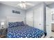 Comfortable bedroom with white headboard, closet, and entry to updated bathroom at 6001 - 1820A S Kings Hwy., Myrtle Beach, SC 29575