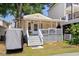 Charming single-story home featuring a welcoming front porch with gray steps and white railing and columns at 6001 - 1820A S Kings Hwy., Myrtle Beach, SC 29575