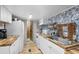 Kitchen with white cabinets, butcher block countertops and beach-themed wallpaper at 6001 - 1820A S Kings Hwy., Myrtle Beach, SC 29575