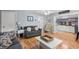 Open-concept living area with stylish furnishings, wood floors, and views into the cute kitchen at 6001 - 1820A S Kings Hwy., Myrtle Beach, SC 29575