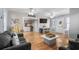 Spacious living room with wood flooring, beachy accents, and dining area near the exterior door at 6001 - 1820A S Kings Hwy., Myrtle Beach, SC 29575