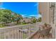 Relaxing balcony area with seating, offering scenic views of the surrounding community and lush greenery at 601 Hillside Dr. N # 302, North Myrtle Beach, SC 29582