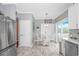 Bright eat-in kitchen features white cabinets and stainless appliances with an access door to an outdoor area at 601 Hillside Dr. N # 302, North Myrtle Beach, SC 29582
