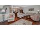 Bright living room with hardwood floors, comfortable seating, and an open view into the adjacent dining area at 601 Hillside Dr. N # 302, North Myrtle Beach, SC 29582