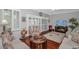 Cozy living room featuring hardwood floors, a decorative rug, comfortable seating, and stylish shutters on the windows at 601 Hillside Dr. N # 302, North Myrtle Beach, SC 29582