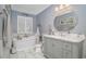 Inviting bathroom features a soaking tub, elegant vanity, and ample natural light at 601 Hillside Dr. N # 302, North Myrtle Beach, SC 29582