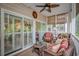 Inviting screened porch with comfortable wicker furniture, providing a perfect spot for relaxation and outdoor enjoyment at 601 Hillside Dr. N # 302, North Myrtle Beach, SC 29582