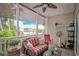 Cozy screened porch features comfortable seating and scenic outdoor views, creating a relaxing retreat at 601 Hillside Dr. N # 302, North Myrtle Beach, SC 29582