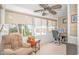 Comfortable sunroom has a desk and recliner creating a cozy workspace with a beautiful view at 601 Hillside Dr. N # 302, North Myrtle Beach, SC 29582