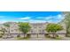 Beautifully landscaped townhomes with a combination of brick and neutral siding, and well-maintained lawns under a blue sky at 601 Hillside Dr. N # 302, North Myrtle Beach, SC 29582