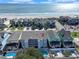 Beautiful aerial view of beach condos near a sparkling pool and the ocean at 612 N Ocean Blvd. # 103, Surfside Beach, SC 29575