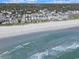 A sprawling beach extends beyond a quaint community of colorful beach houses at 612 N Ocean Blvd. # 103, Surfside Beach, SC 29575