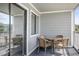 Balcony with outdoor table and chairs and view of neighboring buildings at 612 N Ocean Blvd. # 103, Surfside Beach, SC 29575