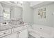 Well-lit bathroom featuring a soaking tub and modern vanity with vessel sink at 612 N Ocean Blvd. # 103, Surfside Beach, SC 29575