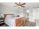 Relaxing bedroom with a wooden sleigh bed and a ceiling fan that creates a comfortable and inviting space at 612 N Ocean Blvd. # 103, Surfside Beach, SC 29575