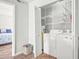 Convenient laundry area with washer, dryer, and ample storage shelving at 612 N Ocean Blvd. # 103, Surfside Beach, SC 29575