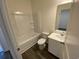 Bright bathroom features a tub, toilet, vanity, and modern fixtures at 620 Muster Field Ct., Conway, SC 29526