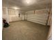 Two car garage with concrete flooring and a white garage door at 620 Muster Field Ct., Conway, SC 29526